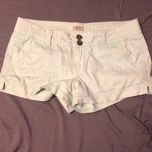 Women’s turquoise BKE shorts.
